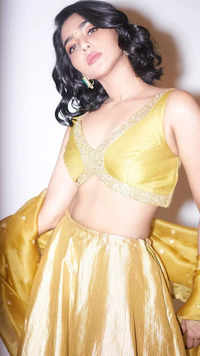 Aishwarya Lekshmi captivates in a vibrant yellow lehenga with sleek short hair​