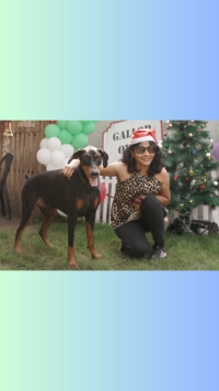 A <i class="tbold">pet owner</i> posed for a festive pick with her pet