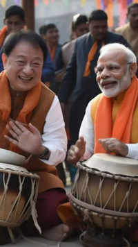 ​<i class="tbold">fumio kishida</i> and PM Modi play the dholak