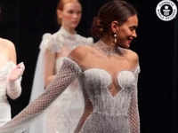 Wedding dress with over 50,000 Swarovski crystals makes <i class="tbold">guinness</i> Book of World Records