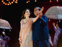 Mukesh Ambani and his <i class="tbold">wife</i> Nita Ambani dancing on stage