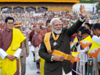 Waving of Indian and Bhutanese <i class="tbold">flag</i>s to greet PM