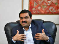 <i class="tbold">gautam adani</i>