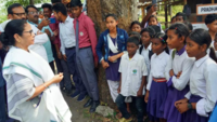 <i class="tbold">Mamata Banerjee</i> interacted with school children