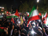 <i class="tbold">demonstrators</i> gathered outside the British embassy in Tehran