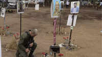 Paying tribute to soldiers, <i class="tbold">civilians killed</i>