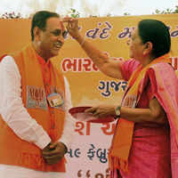 Check out our latest images of <i class="tbold">cm vijay rupani</i>