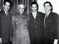 Dilip Kumar, Raj Kapoor, and Dev Anand strike a pose with Pandit Jawaharlal Nehru