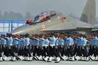 IAF personnel march past a Sukhoi-30 MKI fighter plane