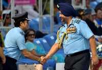 Captain of IAF Sachin Tendulkar is greeted by Air Chief Marshal BS Dhanoa