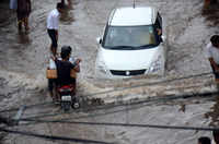 <i class="tbold">monsoon rains</i> paralyse several parts of India