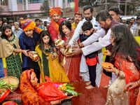 Union minister and Lok Janshakti Party president Ramvilas Paswan along with his son Chirag Paswan and other family members performs rituals during Chhath Puja in Patna (PTI photo)