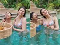 Chilling out in the pool with her bestie at <i class="tbold">gili islands</i>