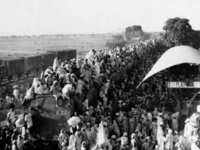 India-Pak partition Refugees atop the roof of a train