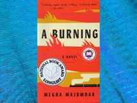 A <i class="tbold">burning</i> by Megha Majumdar