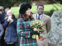 Middleton's <i class="tbold">miu miu</i> coat embellished with gold buttons at a Christmas Day service