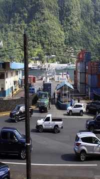 Traffic leaves the Port of Pago Pago after closing because a <i class="tbold">tsunami warning</i>.