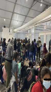 Migrants inside of a US customs and border protection temporary overflow facility in Donna, Texas.