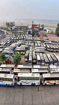 Buses stand parked at a terminal during a <i class="tbold">nationwide strike</i> in Vijayawada.