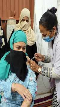 A medic administers the vaccine to a beneficiary in Bhopal.