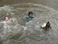 Children playing in waterlogged streets of Mumbai