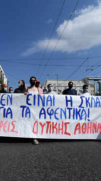 Greece's biggest labor unions stage a 24-hour strike to protest a draft labor bill