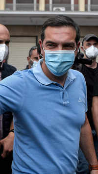 Former Greek Prime Minister Alexis Tsipras arrives to take part in the 24-hour general strike