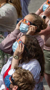 Students from the Broeders' School look at a partial solar eclipse in Roeselare.