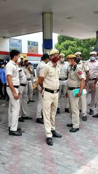 Police personnel stands guard during the protest.