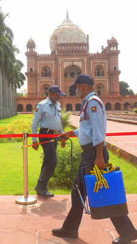 Staff worker sanitizes the area of Safdarjung Tomb