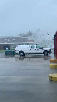 Rain blows off roof of Lady Of The Sea hospital building in <i class="tbold">galliano</i>, Louisiana.