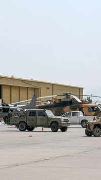 Afghan Air forces' military aircrafts and vehicles are pictured near a hangar at the airport.