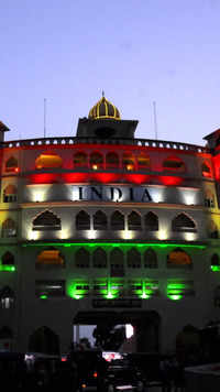 The Indian side gate of <i class="tbold">attari</i>-Wagha border post illuminates with tricolour.