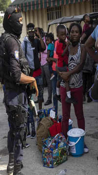 Haitian migrants deported from the US gather after arriving to the airport in Port-au-Prince, Haiti.