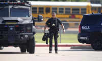 A law enforcement officer in the parking lot of Timberview High School after the shooting inside.