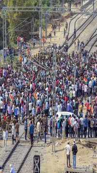Agitating farmers sat on a goods carrying train which was standing at the track and started shouting slogans.