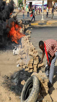 udanese protesters use bricks and burning tyres to block 60th Street in the capital <i class="tbold">khartoum</i>.