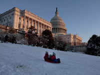 ​People go sledding on the West Front of the US <i class="tbold">capitol</i> Building on January 04