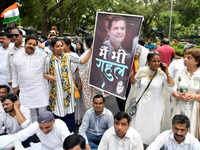 Congress leaders take part in a protest march from the <i class="tbold">aicc</i> office to the ED office in support of party leader Rahul Gandhi, in New Delhi.