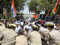 Police stop Congress workers during a protest outside the <i class="tbold">aicc</i> office against summoning of party leader Rahul Gandhi by the ED, in New Delhi.