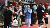Prime Minister Narendra Modi gestures upon his arrival to attend honour guard ceremony for Droupadi Murmu after she took her oath as India's President Reuters
