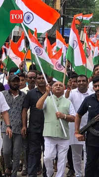 Nitin Patel, in a video, can be seen holding a tricolour and walking with a group of people
