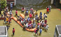 <i class="tbold">fire fighters</i> evacuate residents from flooded areas in Bengaluru. (Photo: PTI)