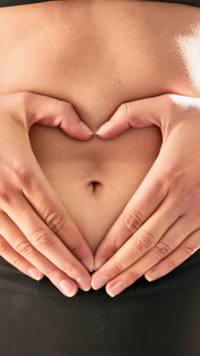 One should clean the belly button with warm water and mild soap to prevent infection and microbial growth.