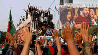 Imran Khan leads a march to pressure the government to announce new elections, in Lahore