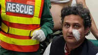 Faisal Javed, a senator and close aid of Khan, who was also injured in the shooting incident, waits to receive first aid in Wazirabad, Pakistan.