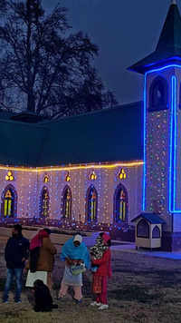 Holy Family <i class="tbold">catholic church</i> illuminated on Christmas