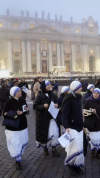 Faithful walk into St. Peter's Square at the Vatican