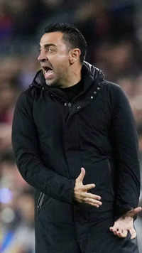​<i class="tbold">xavi</i> reacts during the game
