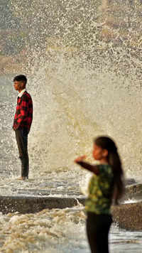 Young people catch the waves on Dadar <i class="tbold">chowpatty</i> in Mumbai.
